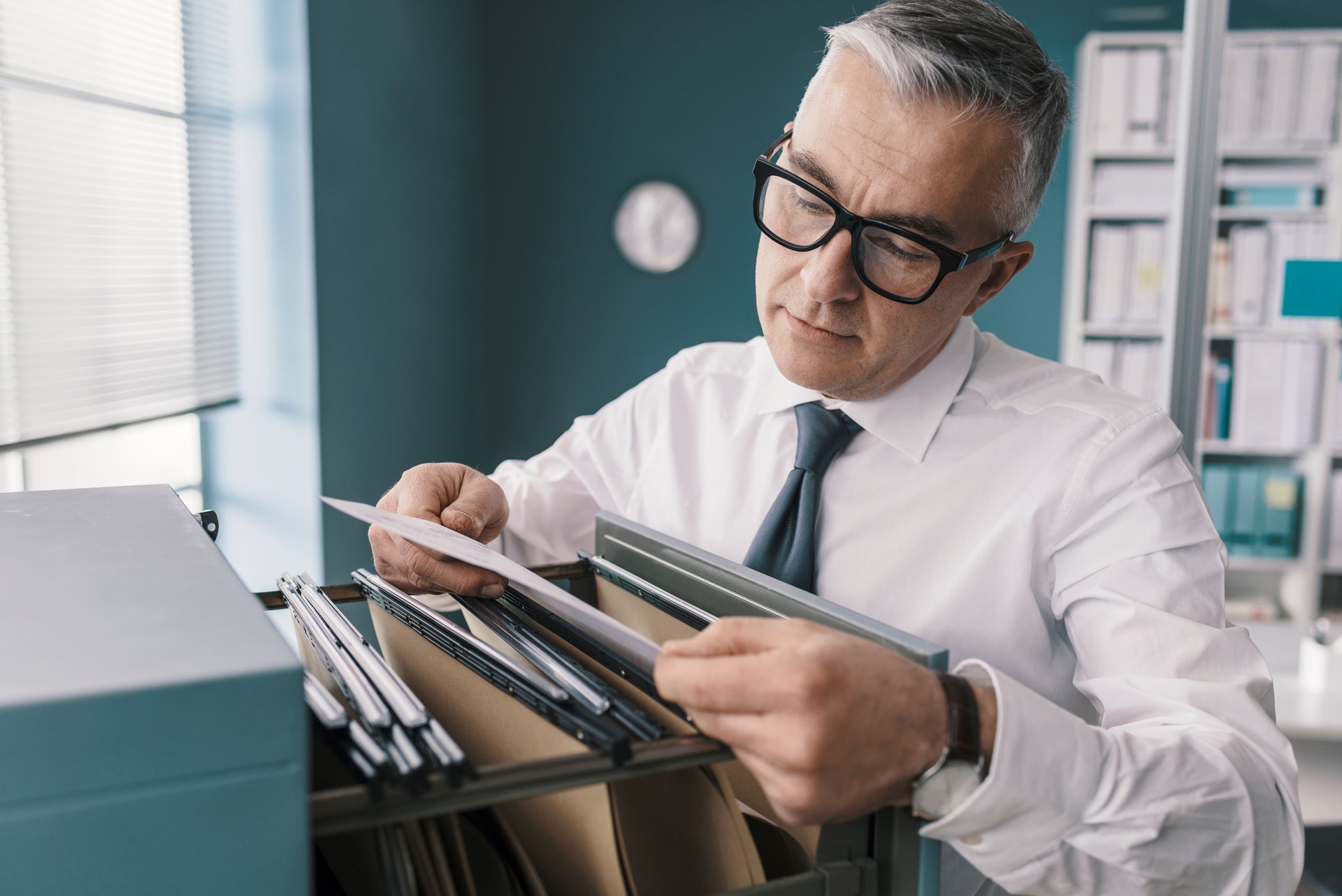 Businessman searching for files and documents